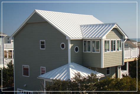 metal roof on a white house|white metal roofing material.